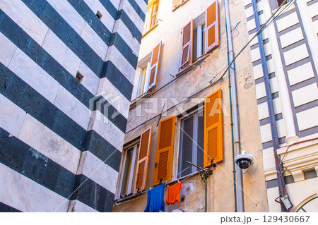 Shutters on the windows. Colorful houses buildings. Monterosso Italian village. Cinque Terre narrow street architecture, Liguria, Italy. Shutters on the windows. Colorful houses buildings. Monterosso Italian village. Cinque Terre narrow street architecture, Liguria, Italy. 129430667