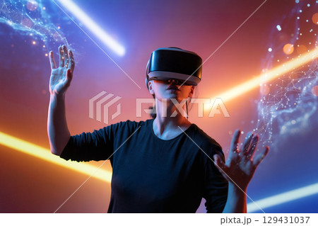 Woman with VR virtual reality goggles Woman with VR virtual reality goggles 129431037