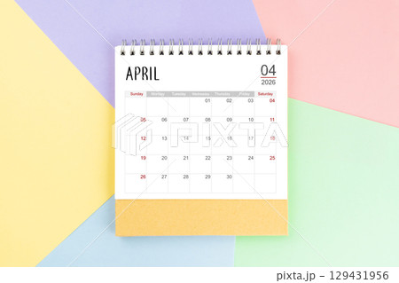 April 2026 month desk calendar for 2026 year on colorful background. 129431956