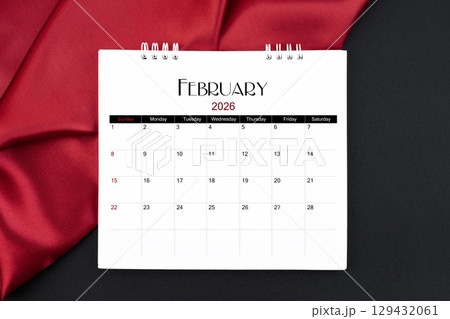 February 2026 Monthly desk calendar with red silk on black color leather background. February 2026 Monthly desk calendar with red silk on black color leather background. 129432061