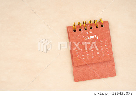 January 2026 red color mini calendar on old brown paper. January 2026 red color mini calendar on old brown paper. 129432078
