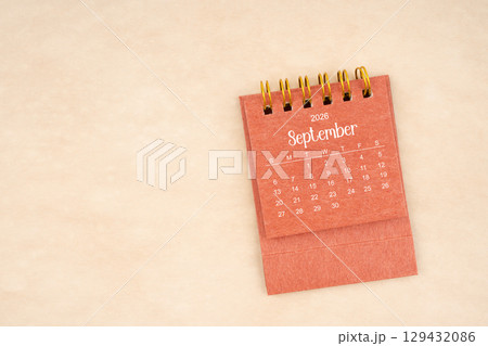 September 2026 red color mini calendar on old brown paper. September 2026 red color mini calendar on old brown paper. 129432086