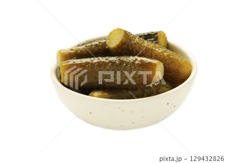 Cucumber sour on plate isolated on white background. 129432826