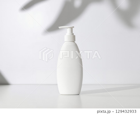 cream bottle on white table 129432933