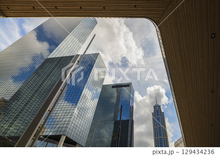 ROTTERDAM, NETHERLANDS, August 1, 2025. Modern skyscrapers of Rotterdam in glass reflections ROTTERDAM, NETHERLANDS, August 1, 2025. Modern skyscrapers of Rotterdam in glass reflections 129434236