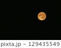 Full moon in a black night sky close up 129435549