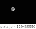 Full moon in a black night sky close up 129435550