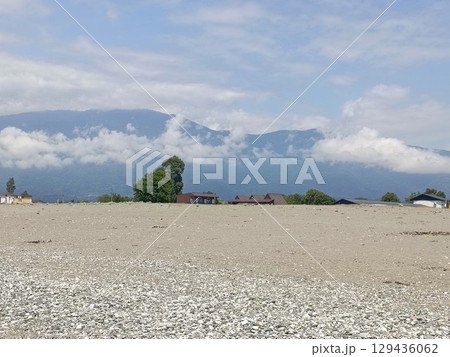 Seaside village in a rustic style, in blue and brown colors, representing coastal living and summer holidays, with copy space Seaside village in a rustic style, in blue and brown colors, representing coastal living and summer holidays, with copy space 129436062