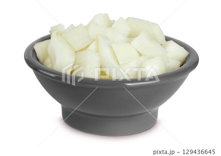 Onion slices in a ceramic bowl isolated on a white background 129436645