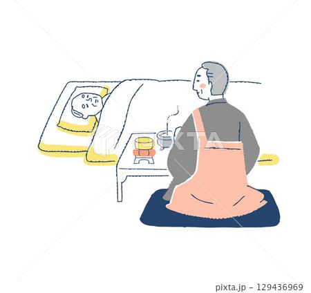 ご臨終　ご遺体の前で枕経をする僧侶 129436969