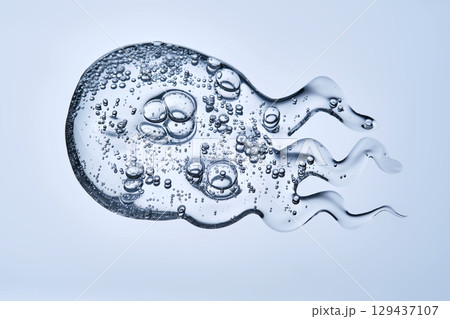 Delicious serum texture with bubbles on a blue background. 129437107