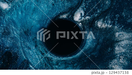 Ink particles. Blur glitter portal. Defocused blue color sparkling water circle frame liquid swirling on abstract art dark black background. 129437138