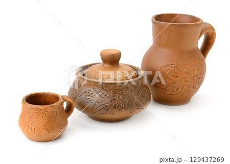 Clay jug, pot and cup isolated on white 129437269