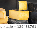 Assorted cheese varieties at a market stall 129438761