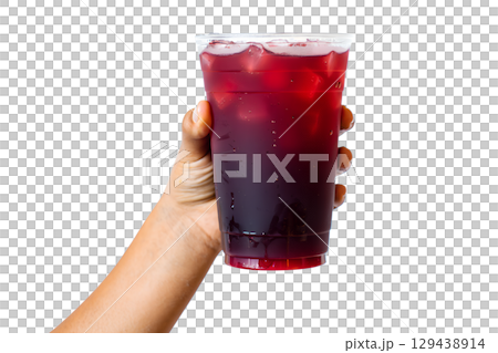 Hand holding refreshing iced beverage in clear cup, cold summer drink with condensation droplets 129438914