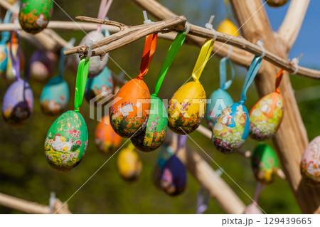 Easter eggs hanging on a branch Easter eggs hanging on a branch 129439665