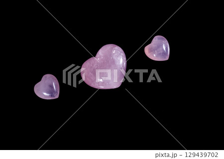 Macro mineral stone Heart pink quartz on a black background 129439702
