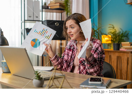 Businesswoman working on laptop at office desk talking online communication video call with employee Businesswoman working on laptop at office desk talking online communication video call with employee 129440466