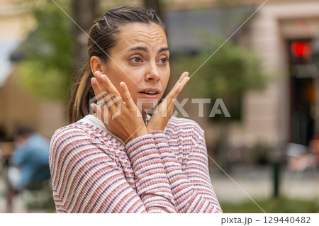 Sad unhappy frustrated woman girl walking alone in city street, feeling bad, annoyed, grief, problem 129440482