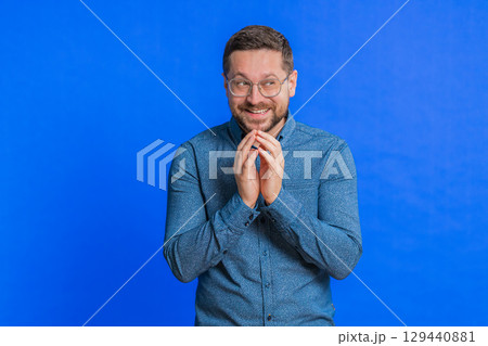 Sneaky cunning mature man thinking over devious villain idea, cheats, jokes, pranks, evil plan Sneaky cunning mature man thinking over devious villain idea, cheats, jokes, pranks, evil plan 129440881