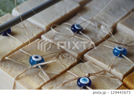 Handmade soap bars with decorative beads on display Handmade soap bars with decorative beads on display 129441673