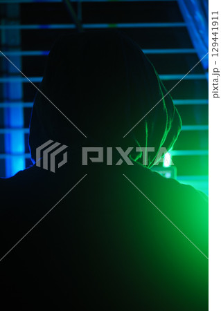 a hacker working in a dark room, cyber crime concept a hacker working in a dark room, cyber crime concept 129441911