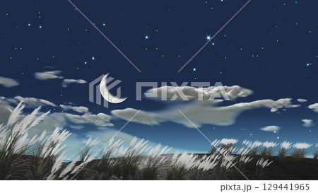 ススキの背景にぽっかりと浮かぶ三日月　文字入れ用背景素材 129441965