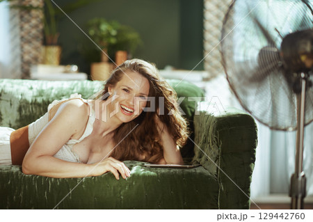 Laughing Woman Enjoying Home Comforts 129442760