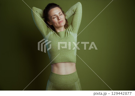 Green Serenity: Woman Stretching Green Serenity: Woman Stretching 129442877