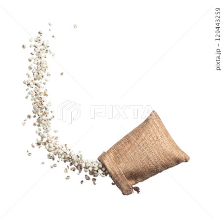 Job's Tear flying in sack bag, white grain job tear float abstract cloud fly. Beautiful job's tear sack bag splash in air, food object design. Wooden background isolated high speed freeze motion 129443259