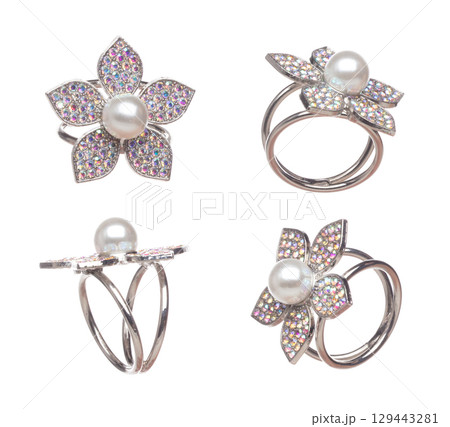 Fashion shinny pearl colorful Ring with beautiful work detail is value. Luxury precious pearl Ring is fashion trend and fly in air. White background isolated Fashion shinny pearl colorful Ring with beautiful work detail is value. Luxury precious pearl Ring is fashion trend and fly in air. White background isolated 129443281