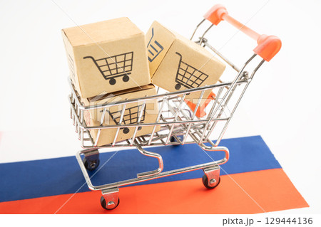 Shopping cart box on Russai flag, import export, finance commerce. 129444136