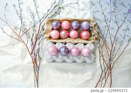 Close-up view of chicken eggs, homemade easter cake and willow twigs 129445371
