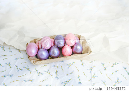 Close-up view of chicken eggs, homemade easter cake and willow twigs 129445372