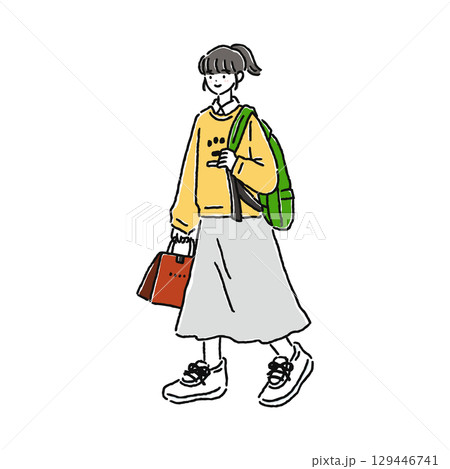 カジュアルでおしゃれな女性・歩く 129446741