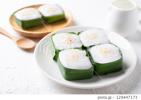 Traditional Thai dessert (Khanom Tako), Pudding with coconut cream topping in pandan leaf Traditional Thai dessert (Khanom Tako), Pudding with coconut cream topping in pandan leaf 129447173