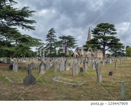 Historic Church and Cemetery Under Cloudy Skies Historic Church and Cemetery Under Cloudy Skies 129447909