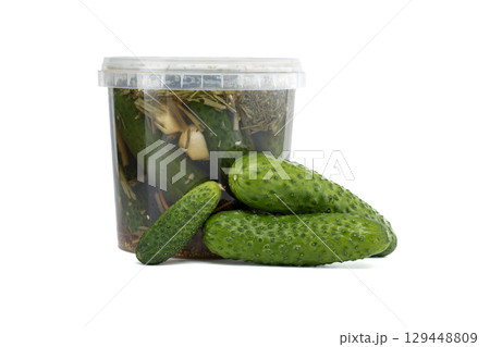 Fresh Cucumbers with Pickle Ingredients in a Transparent Container 129448809