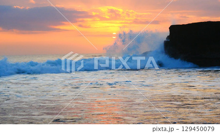 Tropical sea beach in summer time on sunny day. Golden sand beach sea peaceful scenery on the beach. Travel vacation seaside outdoor. Ocean island beautiful dramatic landscape. Sunny seascape scene. 129450079