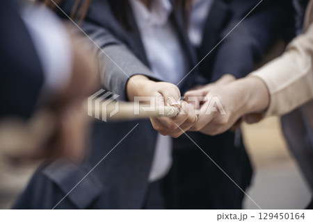 Tug of war Group of business people Hands pulling rope symbol team unified teamwork Partnership Concept. Businesswoman Team holding hands together partnership leader teamwork. diversity competition Tug of war Group of business people Hands pulling rope symbol team unified teamwork Partnership Concept. Businesswoman Team holding hands together partnership leader teamwork. diversity competition 129450164