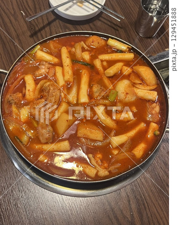 Spicy and hearty dakbokkeumtang with tender chicken, potatoes, and vegetables in rich red sauce. Perfect for Korean cuisine menus, food blogs, and traditional comfort food features! Spicy and hearty dakbokkeumtang with tender chicken, potatoes, and vegetables in rich red sauce. Perfect for Korean cuisine menus, food blogs, and traditional comfort food features! 129451888
