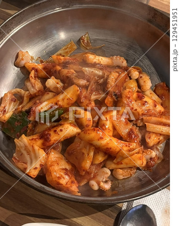 Spicy and savory ojingeo bokkeum with tender stir-fried squid, vegetables, and rich gochujang sauce. A perfect blend of bold flavors and satisfying heat in every bite. 129451951