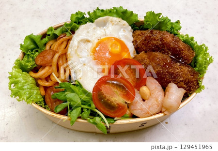 A traditional Korean dosirak, beautifully arranged with rice, assorted banchan, and savory proteins. Balanced and visually inviting, its a portable meal packed with vibrant flavors. A traditional Korean dosirak, beautifully arranged with rice, assorted banchan, and savory proteins. Balanced and visually inviting, its a portable meal packed with vibrant flavors. 129451965