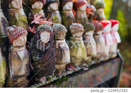 Old Jizu statues in dress and knit hat at Hasedera Temple, Sakurai, Nara 129452382