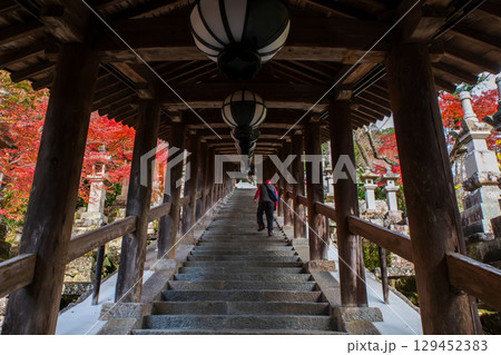 Tourist people at Corridor path to Hasedera temple in autumn, Nara Tourist people at Corridor path to Hasedera temple in autumn, Nara 129452383