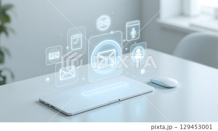 Holographic Email and Digital Communication Icons Above a Laptop. 129453001