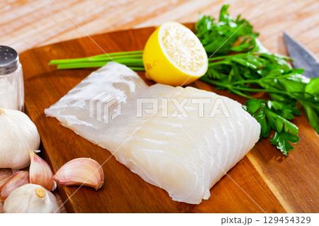Raw pink cusk-eel fish fillet, seafood ingredients 129454329