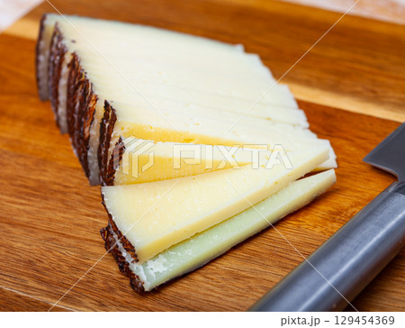 Sliced italian cured sheep cheese Pecorino 129454369