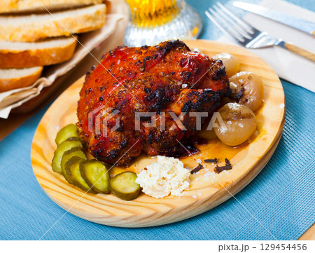 Pork knuckle braised in beer 129454456