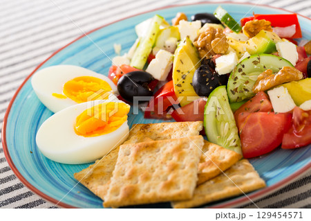 Salad with arugula, olives, Feta cheese, and walnut is tasty dish Salad with arugula, olives, Feta cheese, and walnut is tasty dish 129454571